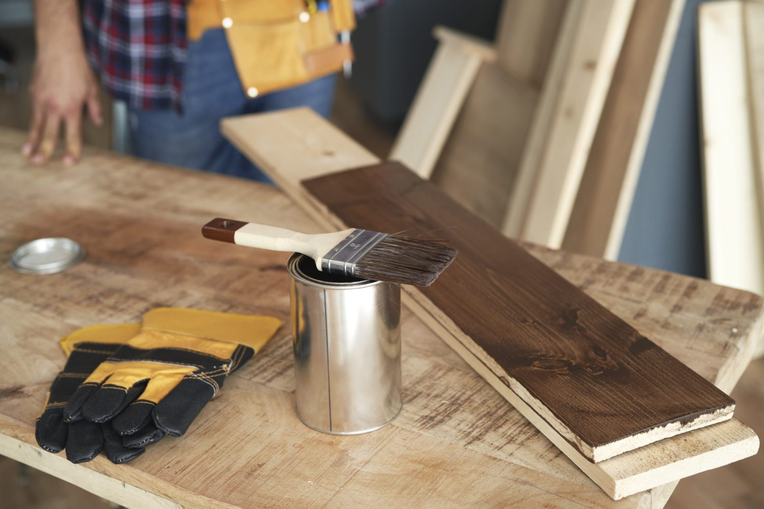 Worktable ready to work with paint can and boards